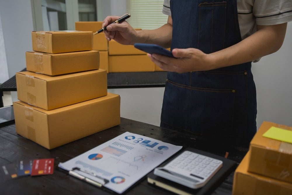 A man identifying the HS codes for packages
